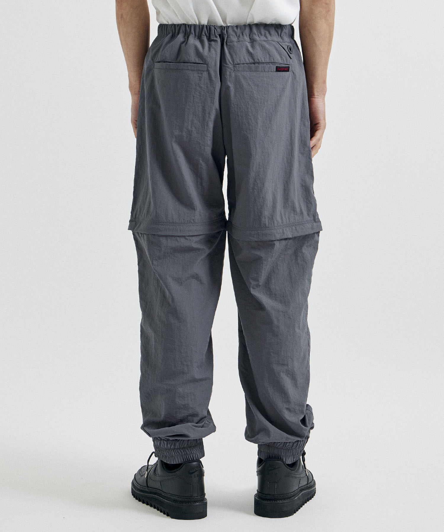 ×GRAMICCI ZIP OFF JOGGER PANTS White Mountaineering